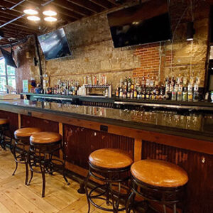 Impressive display of alcohol bottles at the bar back of Portside Nightclub, showcasing an extensive drink selection.